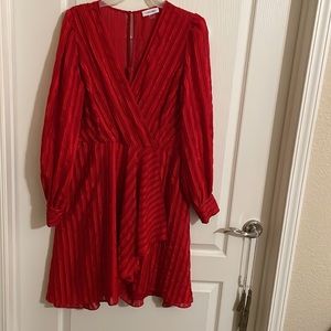 Calvin Klein red mini dress with bell sleeves and wrap style skirt! Size 12